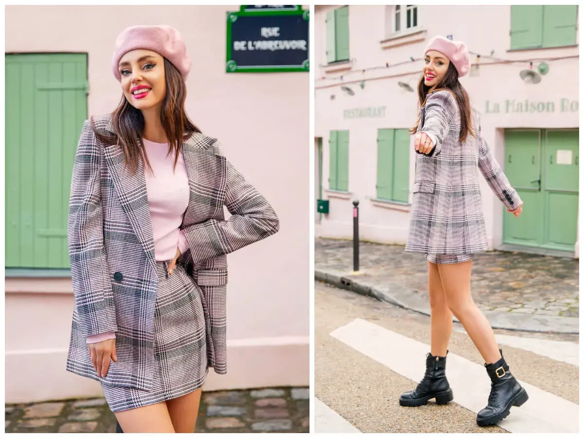 Dziewczyna w różowym beretce i kraciastej marynarce z mini spódniczką, uosobienie preppy style, pozuje na tle paryskiej uliczki.