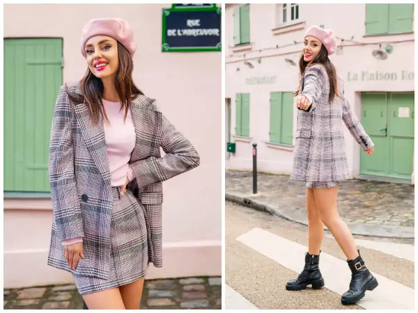 Dziewczyna w różowym beretce i kraciastej marynarce z mini spódniczką, uosobienie preppy style, pozuje na tle paryskiej uliczki.